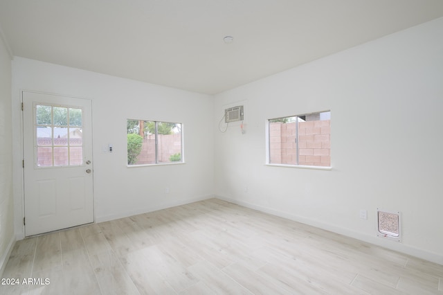 spare room featuring light wood-type flooring