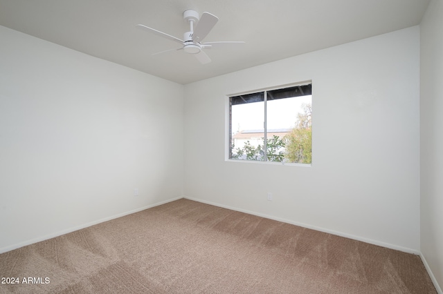 empty room featuring carpet and ceiling fan