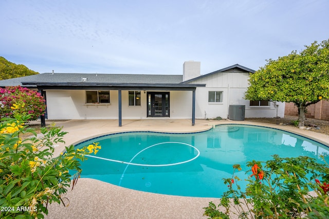 view of pool featuring central AC and a patio area