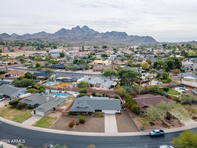 birds eye view of property with a mountain view