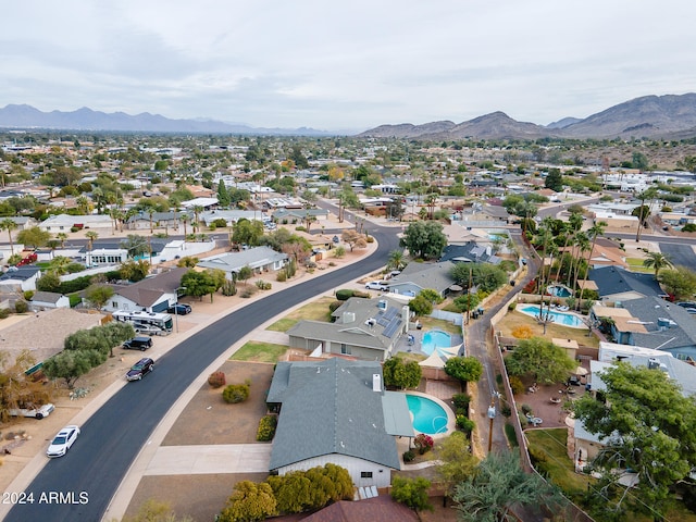 birds eye view of property featuring a mountain view