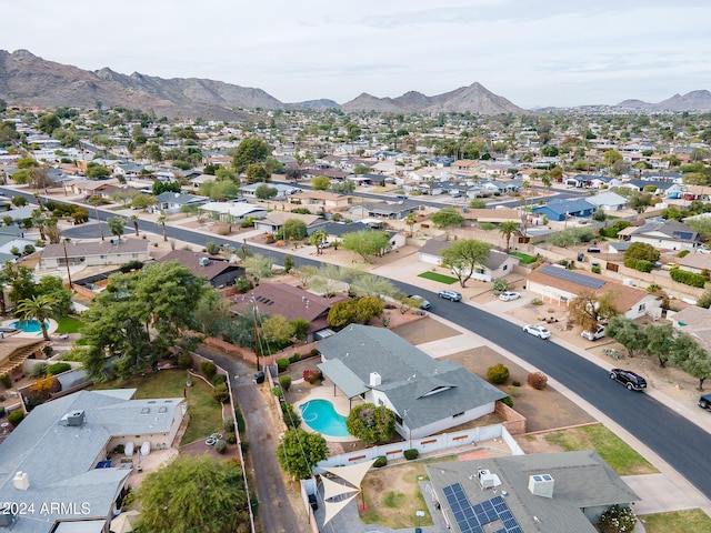 birds eye view of property featuring a mountain view