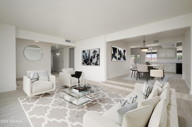 living room with light hardwood / wood-style flooring