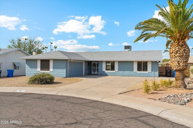 4829 E Apache Cir, Phoenix, AZ 85044 - ranch-style home with a shingled roof, an attached garage, driveway, a gate, and a chimney