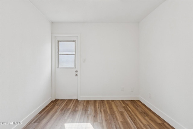 4829 E Apache Cir, Phoenix, AZ 85044 - empty room featuring wood finished floors and baseboards