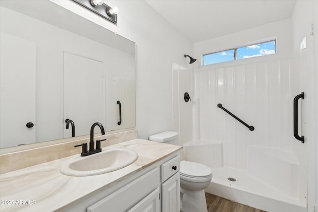 4829 E Apache Cir, Phoenix, AZ 85044 - full bathroom featuring a shower, vanity, and wood finished floors