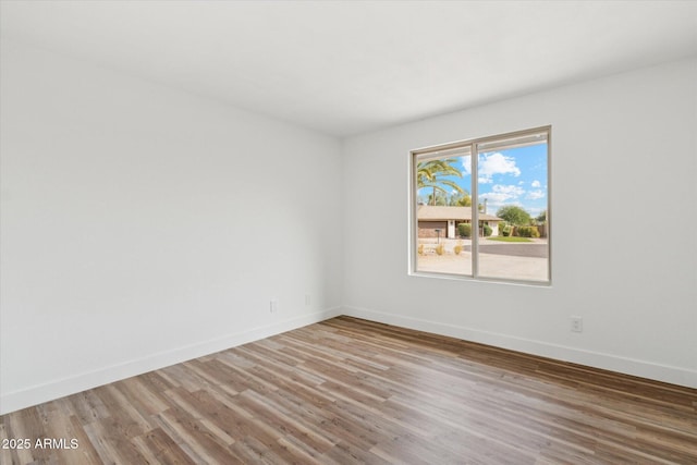 4829 E Apache Cir, Phoenix, AZ 85044 - spare room with light wood finished floors