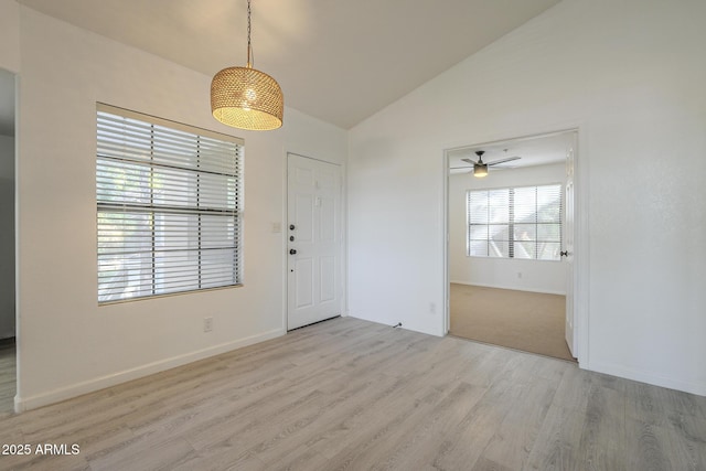 6885 E Cochise Rd Unit 219, Paradise Valley, AZ 85253 - unfurnished dining area featuring wood finished floors, a ceiling fan, and high vaulted ceiling