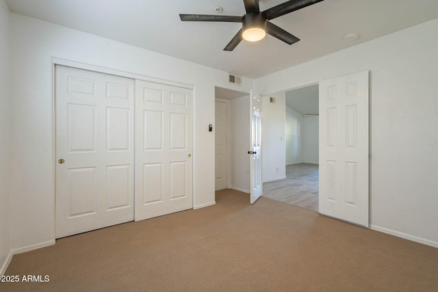 6885 E Cochise Rd Unit 219, Paradise Valley, AZ 85253 - unfurnished bedroom featuring carpet floors, a closet, and a ceiling fan