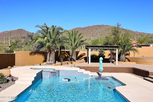 view of pool featuring a pergola, a patio area, a mountain view, and an in ground hot tub