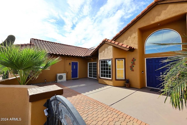 doorway to property featuring ac unit