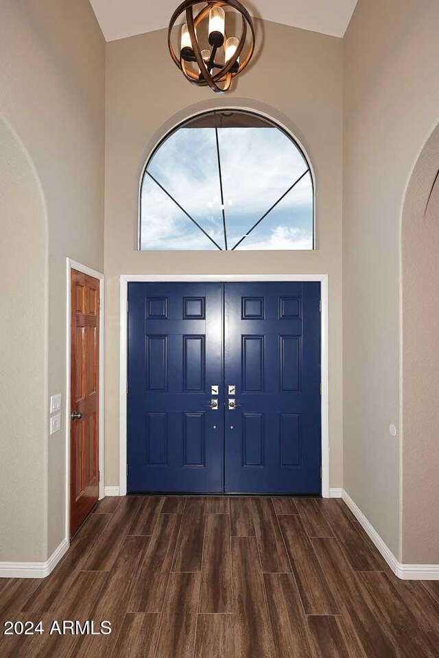 entrance foyer featuring a towering ceiling and a wealth of natural light