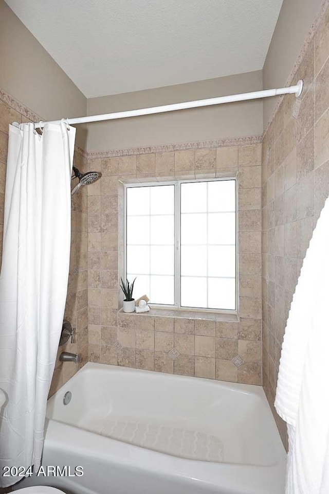 bathroom with shower / bath combo