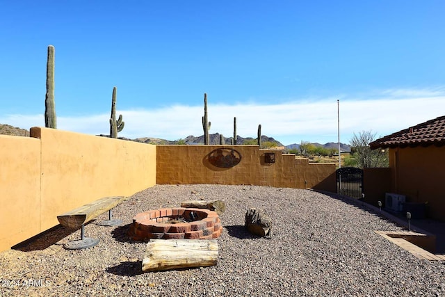 view of yard with a fire pit