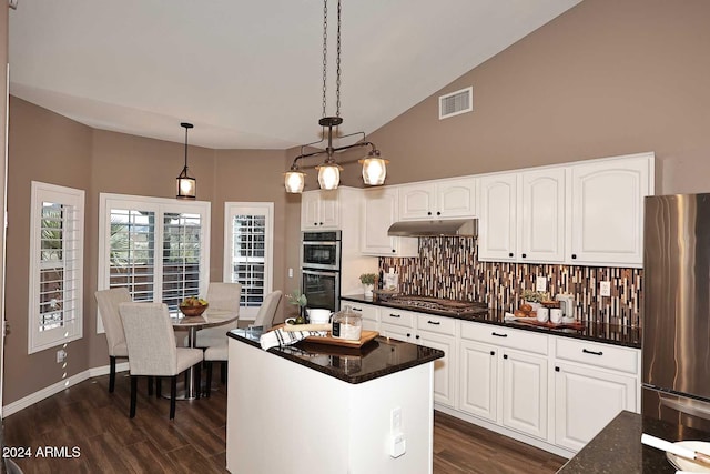 kitchen with pendant lighting, backsplash, dark wood-type flooring, white cabinetry, and stainless steel appliances