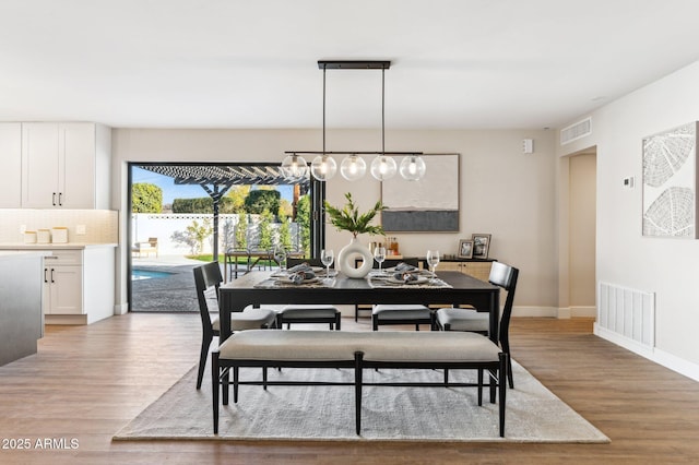 dining area featuring light wood-type flooring