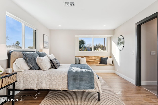 bedroom with wood-type flooring