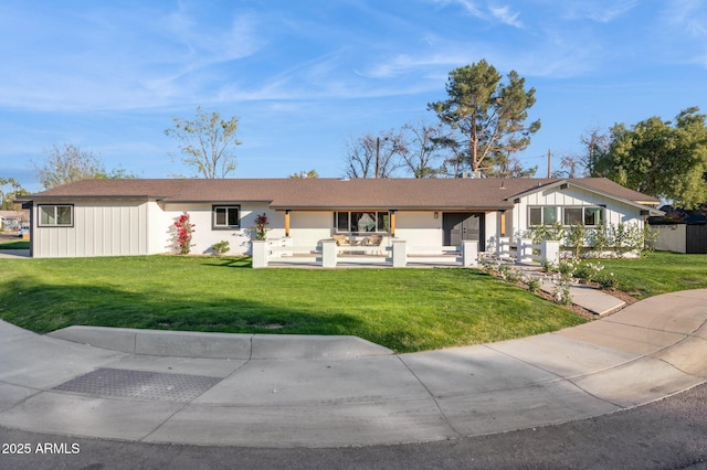 ranch-style house with a front lawn