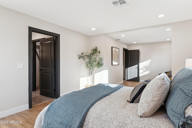 bedroom featuring hardwood / wood-style floors