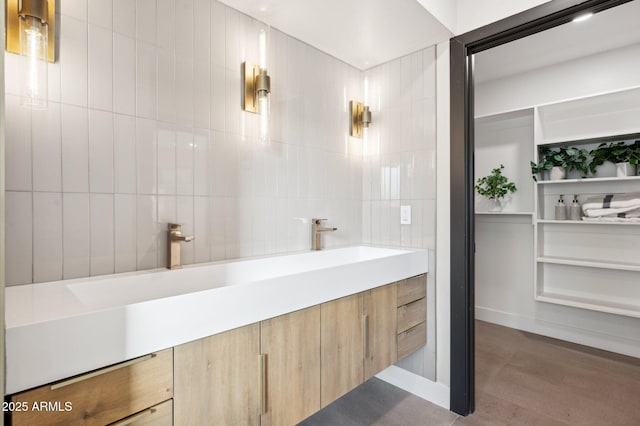 bathroom featuring vanity, tile walls, and hardwood / wood-style flooring