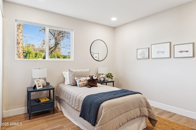 bedroom with light hardwood / wood-style flooring