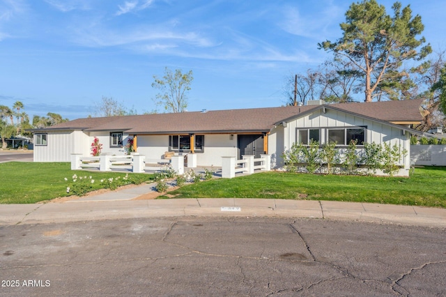 ranch-style house with a front yard