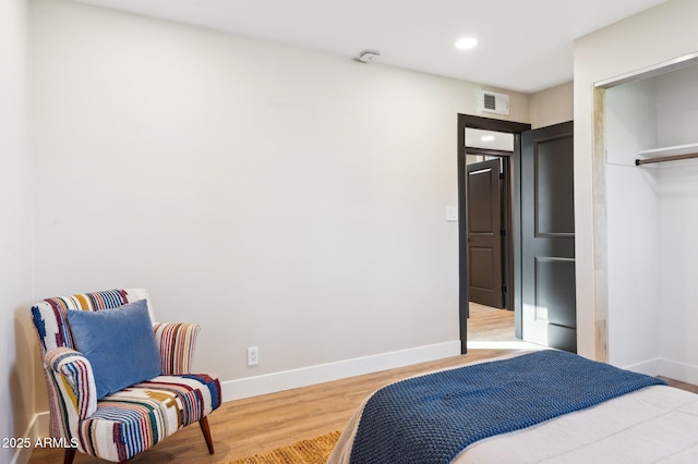 bedroom with hardwood / wood-style floors