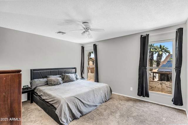 3608 W Harrison St, Chandler, AZ 85226 - bedroom with multiple windows, carpet, a textured ceiling, and a ceiling fan
