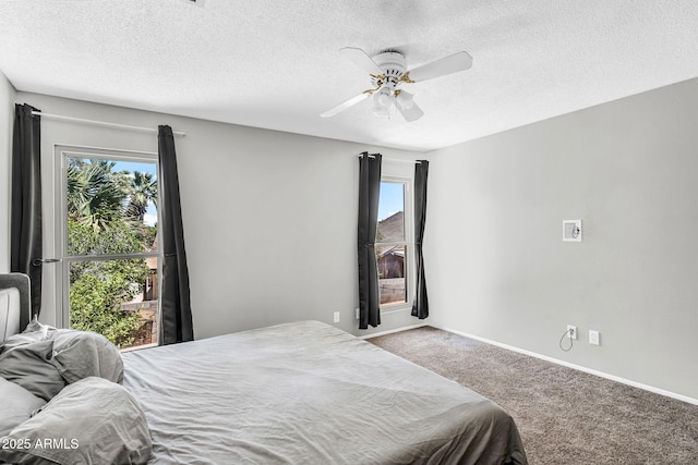 3608 W Harrison St, Chandler, AZ 85226 - carpeted bedroom featuring multiple windows, a textured ceiling, ceiling fan, and baseboards