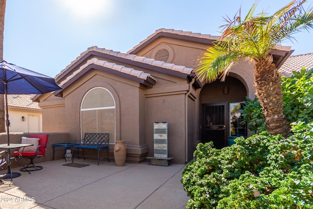 back of house featuring a patio