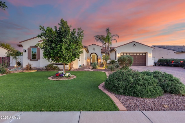 20125 E Via Del Rancho, Queen Creek, AZ 85142 - mediterranean / spanish-style home with concrete driveway, stucco siding, a tiled roof, a garage, and a yard