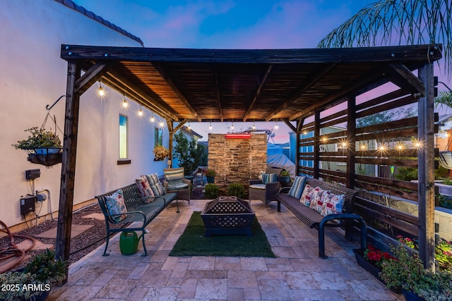 20125 E Via Del Rancho, Queen Creek, AZ 85142 - patio terrace at dusk with an outdoor living space with a fire pit