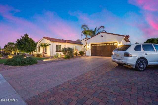 20125 E Via Del Rancho, Queen Creek, AZ 85142 - mediterranean / spanish-style home with stucco siding, an attached garage, a tile roof, and decorative driveway