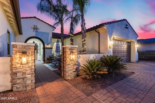 20125 E Via Del Rancho, Queen Creek, AZ 85142 - mediterranean / spanish-style home featuring stucco siding, an attached garage, and a tiled roof
