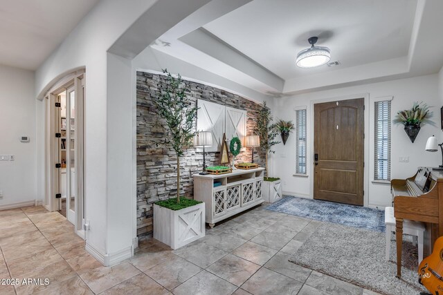 20125 E Via Del Rancho, Queen Creek, AZ 85142 - foyer with light tile patterned flooring, baseboards, a tray ceiling, and visible vents