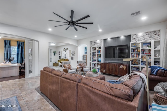 20125 E Via Del Rancho, Queen Creek, AZ 85142 - living room featuring recessed lighting, arched walkways, ceiling fan, visible vents, and built in features