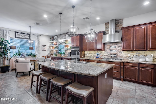 20125 E Via Del Rancho, Queen Creek, AZ 85142 - kitchen with wall chimney range hood, stainless steel appliances, tasteful backsplash, and visible vents