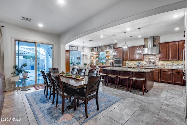 20125 E Via Del Rancho, Queen Creek, AZ 85142 - dining area with visible vents, arched walkways, and recessed lighting