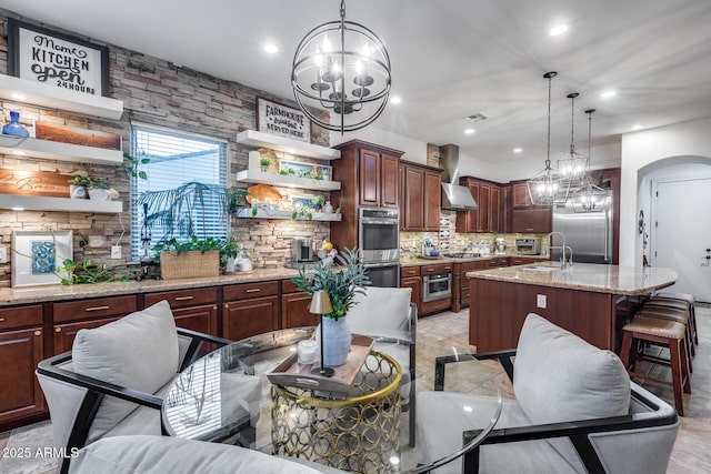 20125 E Via Del Rancho, Queen Creek, AZ 85142 - kitchen featuring wall chimney range hood, a chandelier, open shelves, and appliances with stainless steel finishes