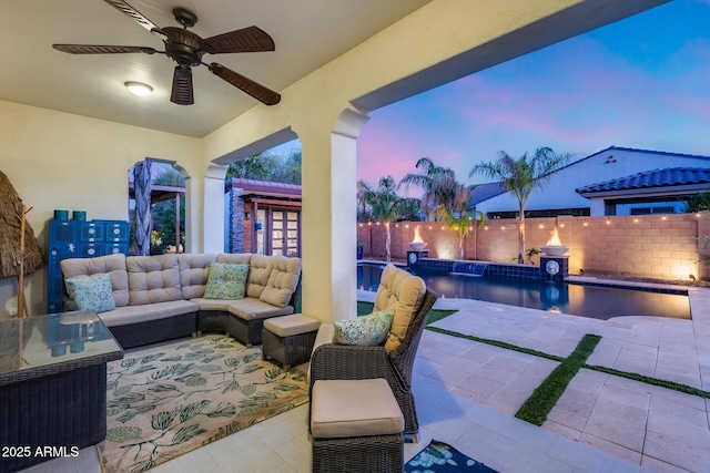 20125 E Via Del Rancho, Queen Creek, AZ 85142 - patio terrace at dusk with outdoor lounge area, a fenced in pool, a fenced backyard, and ceiling fan