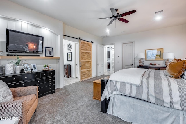 20125 E Via Del Rancho, Queen Creek, AZ 85142 - bedroom with visible vents, a barn door, carpet, and a ceiling fan