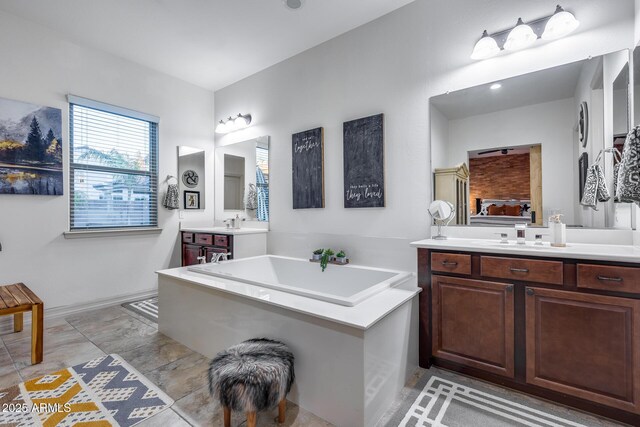 20125 E Via Del Rancho, Queen Creek, AZ 85142 - bathroom with two vanities, a sink, and a garden tub