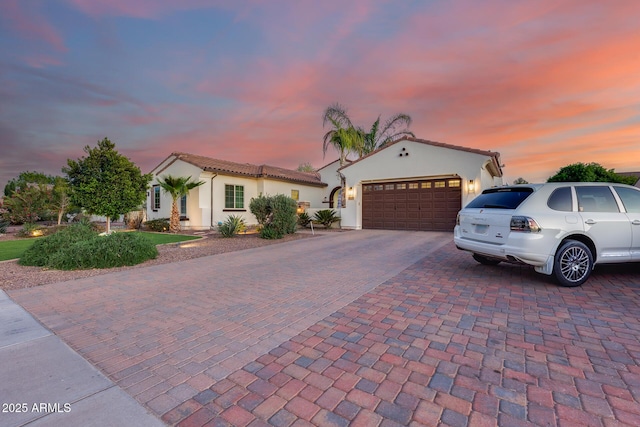 20125 E Via Del Rancho, Queen Creek, AZ 85142 - mediterranean / spanish-style home featuring stucco siding, a garage, a tiled roof, and decorative driveway
