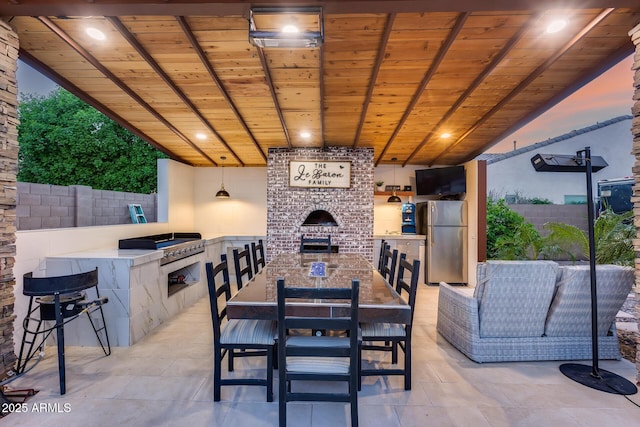 20125 E Via Del Rancho, Queen Creek, AZ 85142 - view of patio / terrace with an outdoor kitchen, an outdoor fireplace, fence, grilling area, and outdoor dining area