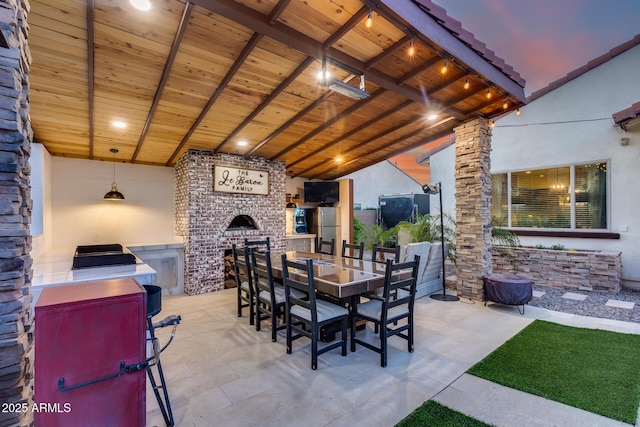 20125 E Via Del Rancho, Queen Creek, AZ 85142 - view of patio / terrace featuring outdoor dining area and a fireplace