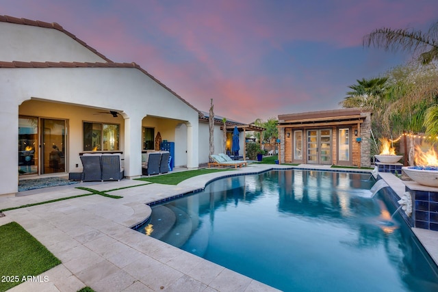 20125 E Via Del Rancho, Queen Creek, AZ 85142 - view of pool featuring an exterior structure, a patio, an outdoor fire pit, a fenced in pool, and an outbuilding