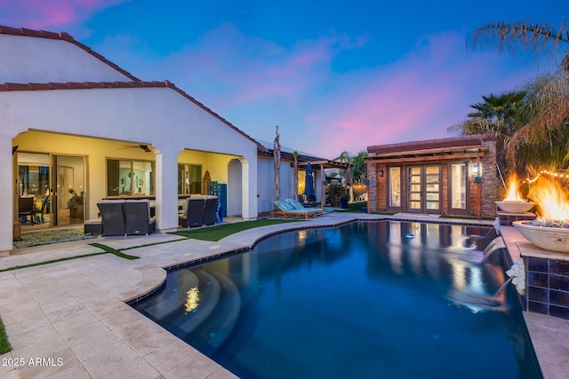 20125 E Via Del Rancho, Queen Creek, AZ 85142 - pool with an outdoor fire pit, an outbuilding, a patio, and an exterior structure