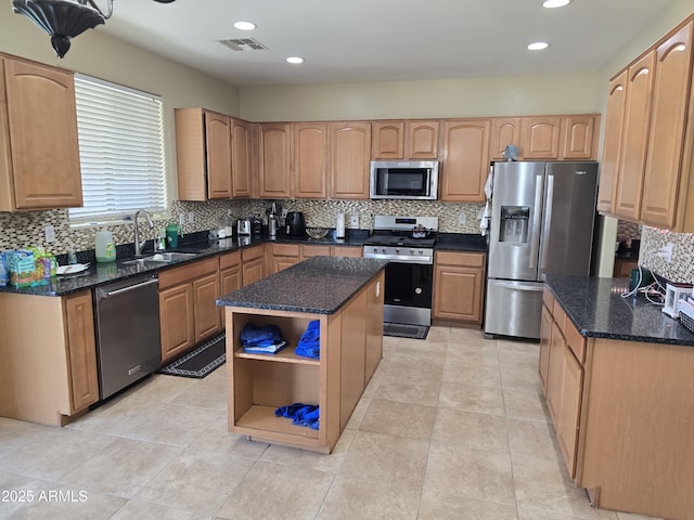 kitchen featuring a sink, visible vents, appliances with stainless steel finishes, dark stone counters, and open shelves