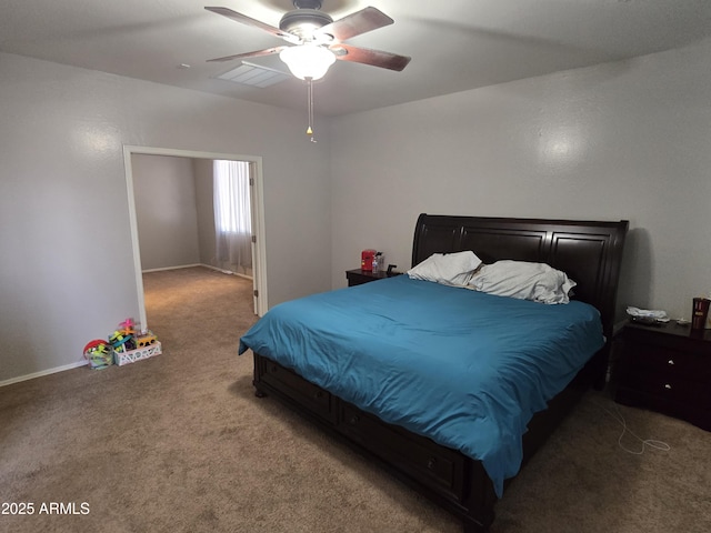 bedroom featuring baseboards, carpet, visible vents, and a ceiling fan