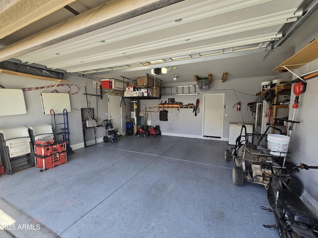 garage with water heater, baseboards, and a garage door opener